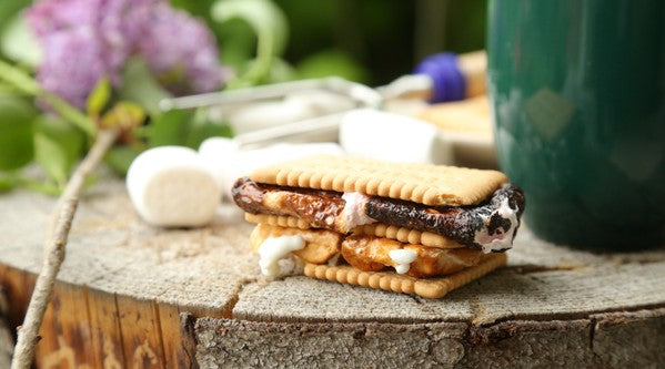 smore and marshmallows on a wooden block