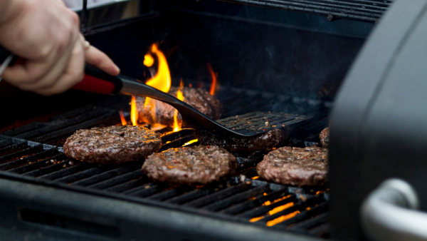 burgers on a fire grill