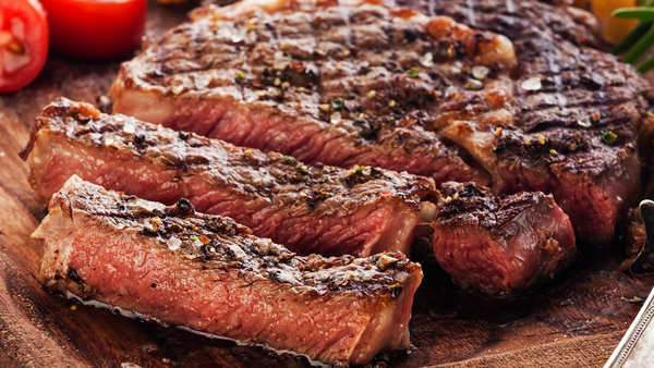 grilled meat resting on a plate